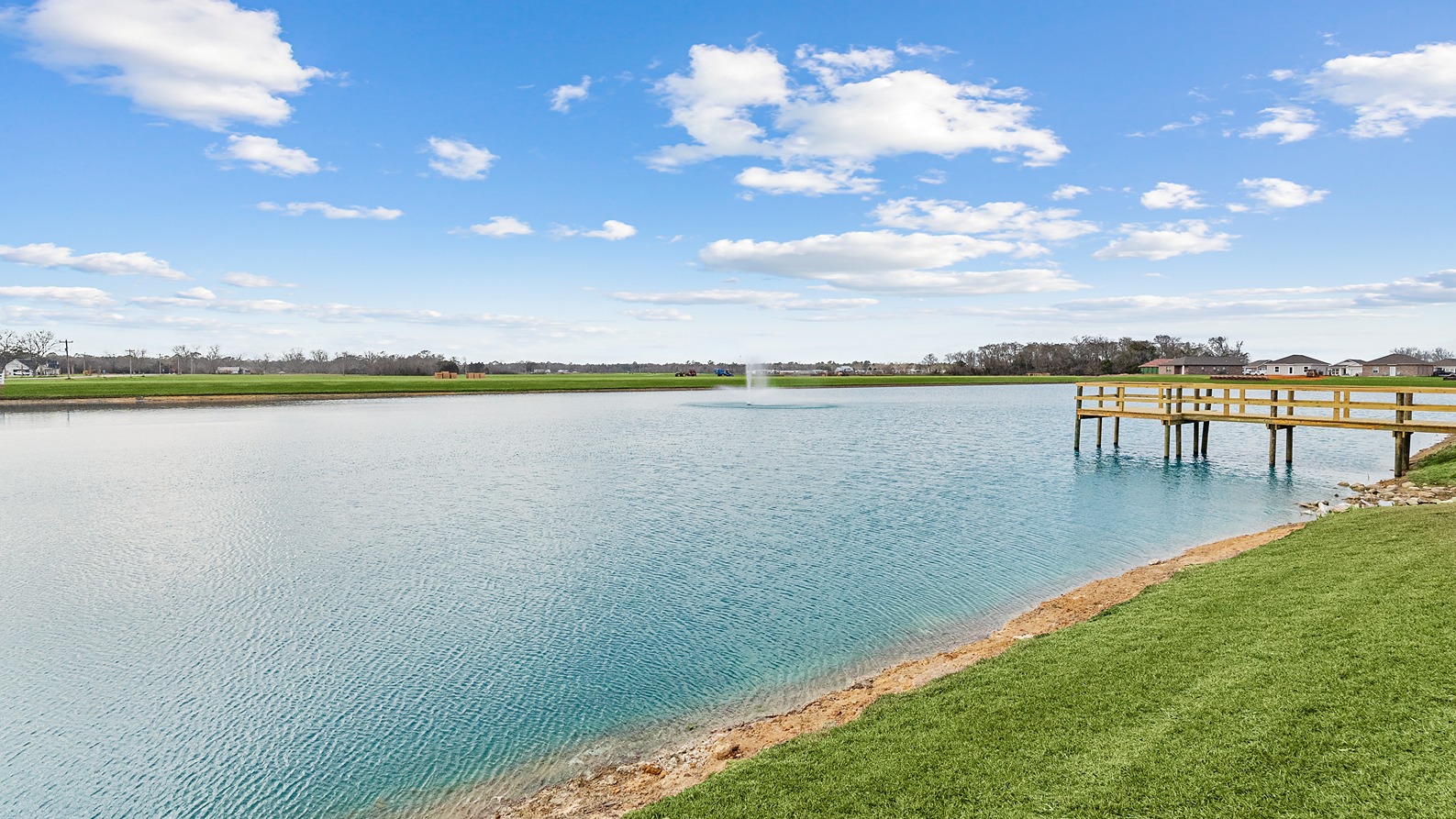 Scenic fishing pond with pier.