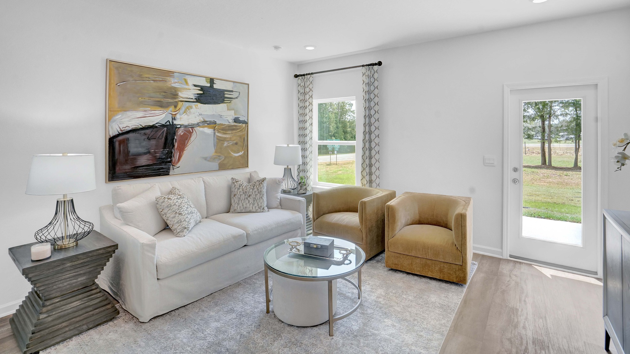 Living room with couch and small table and art on walls.