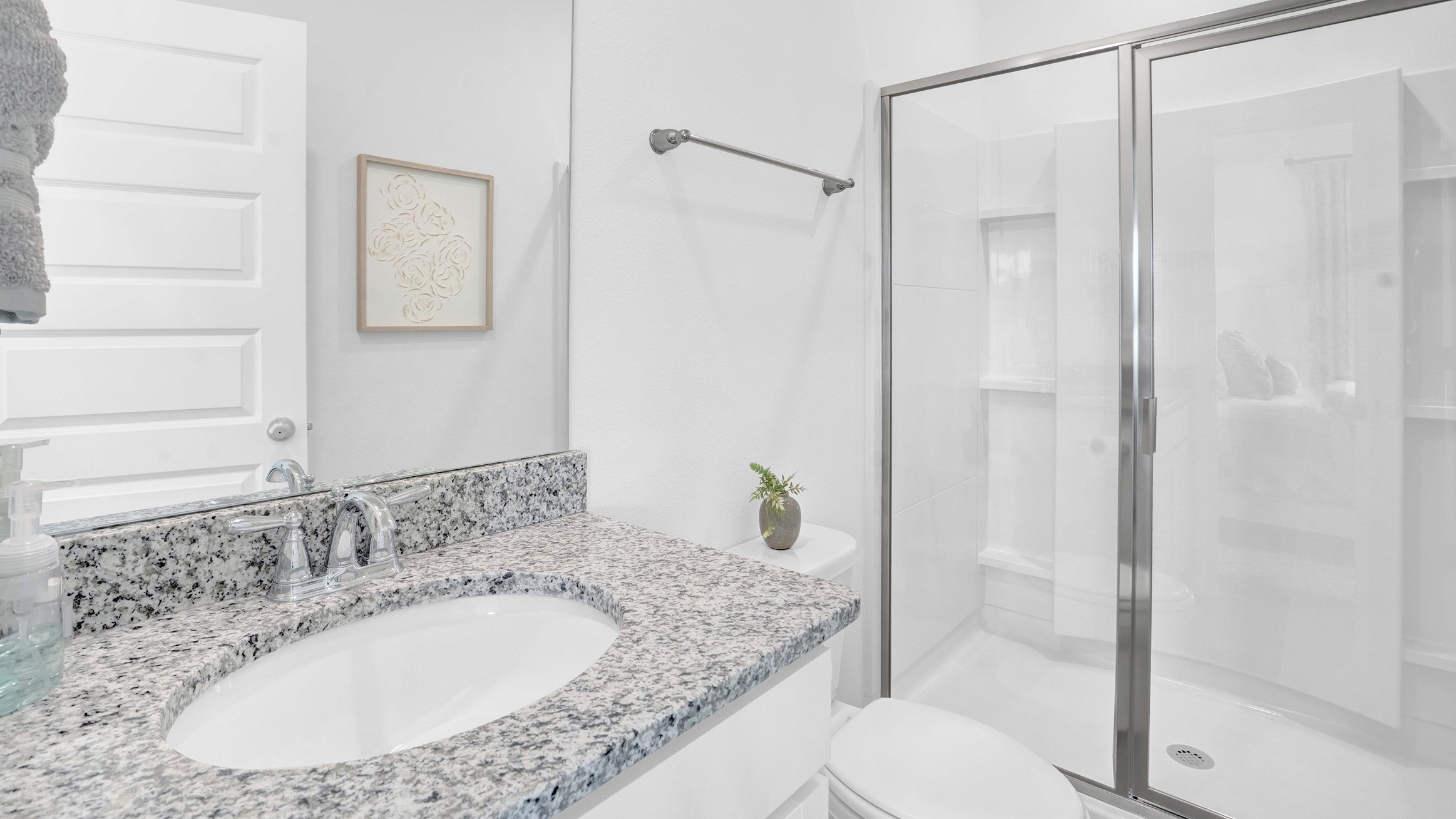 The primary bath has a standup shower and sink.