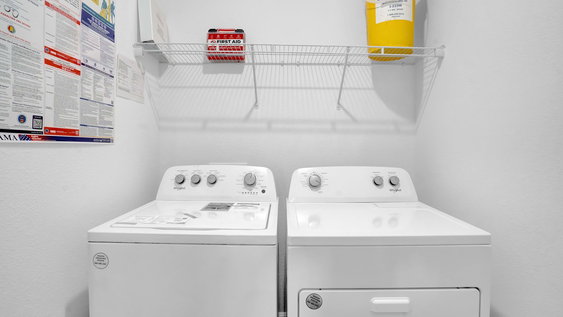 The Laundry room has both washer and dryer and wire shelving.