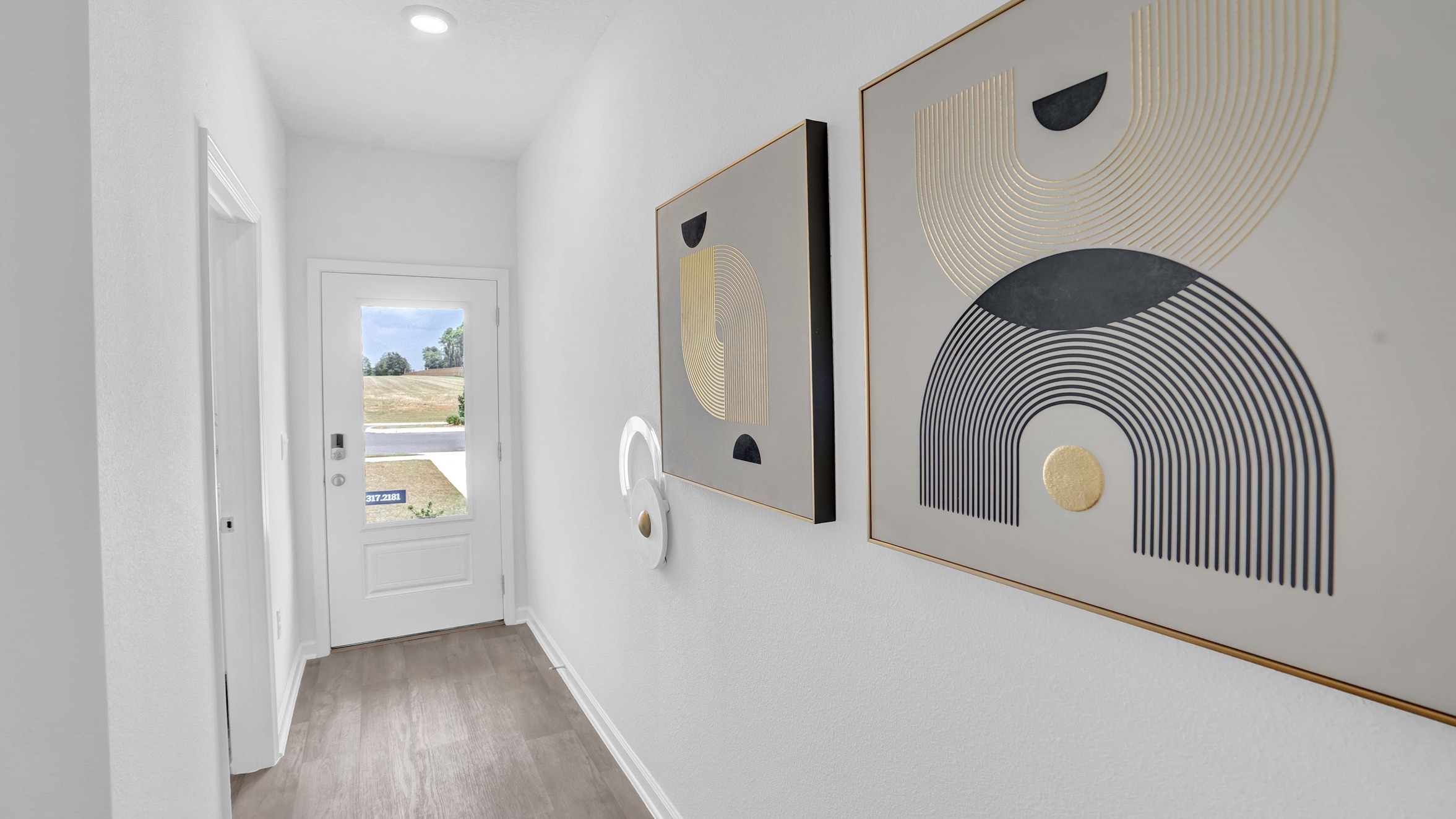 Hallway with art on walls.