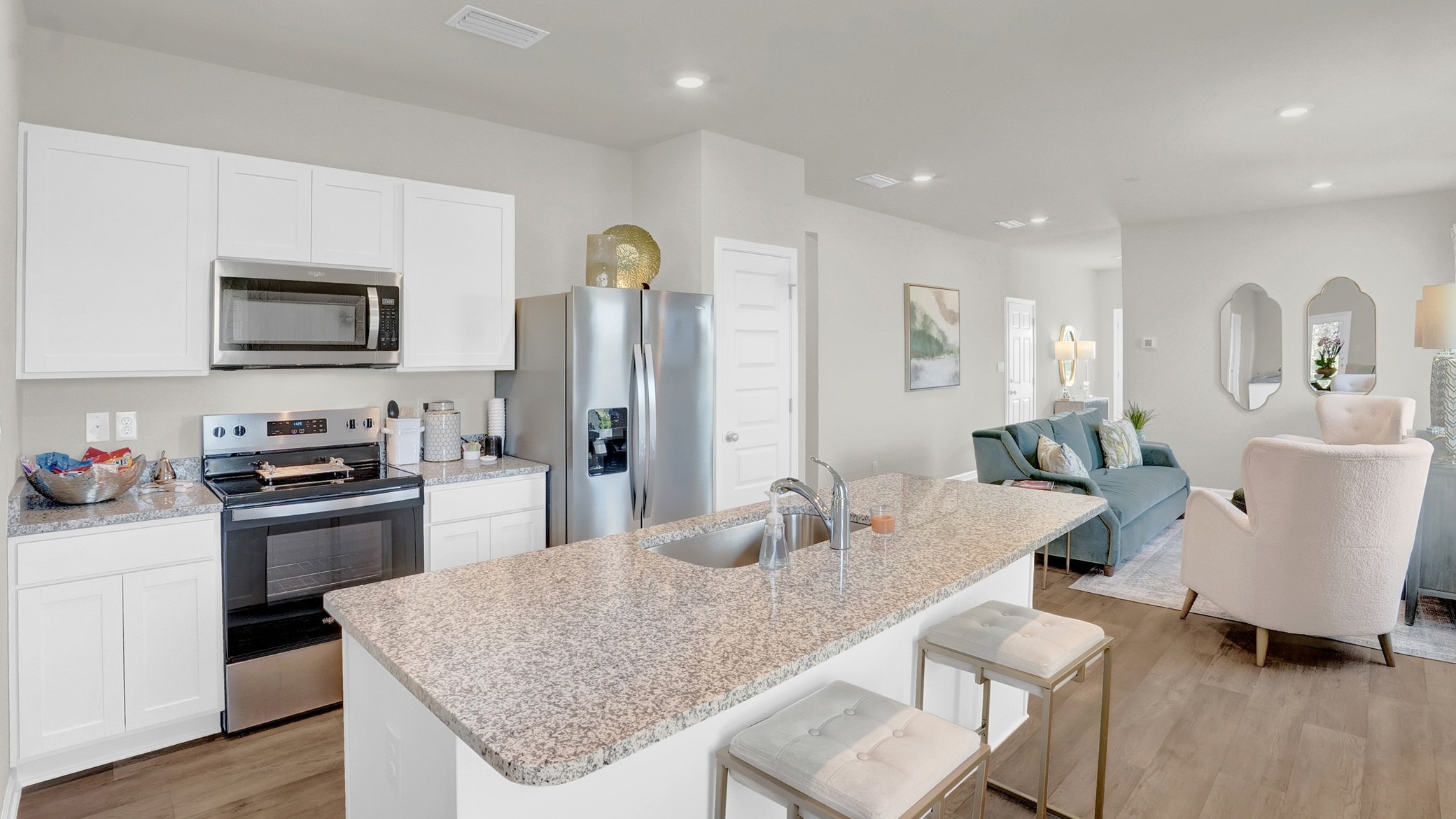 Kitchen area with stainless appliances.