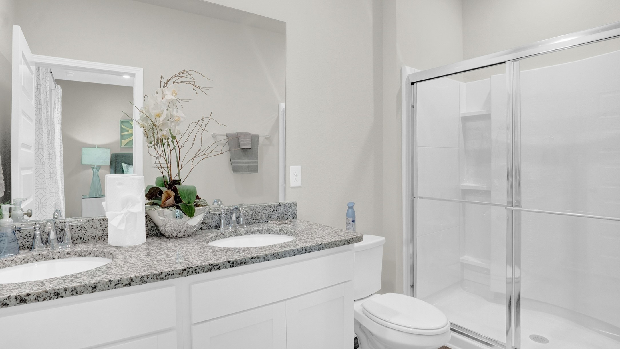 Shower with Jack and Jill sink, shower and toilet.