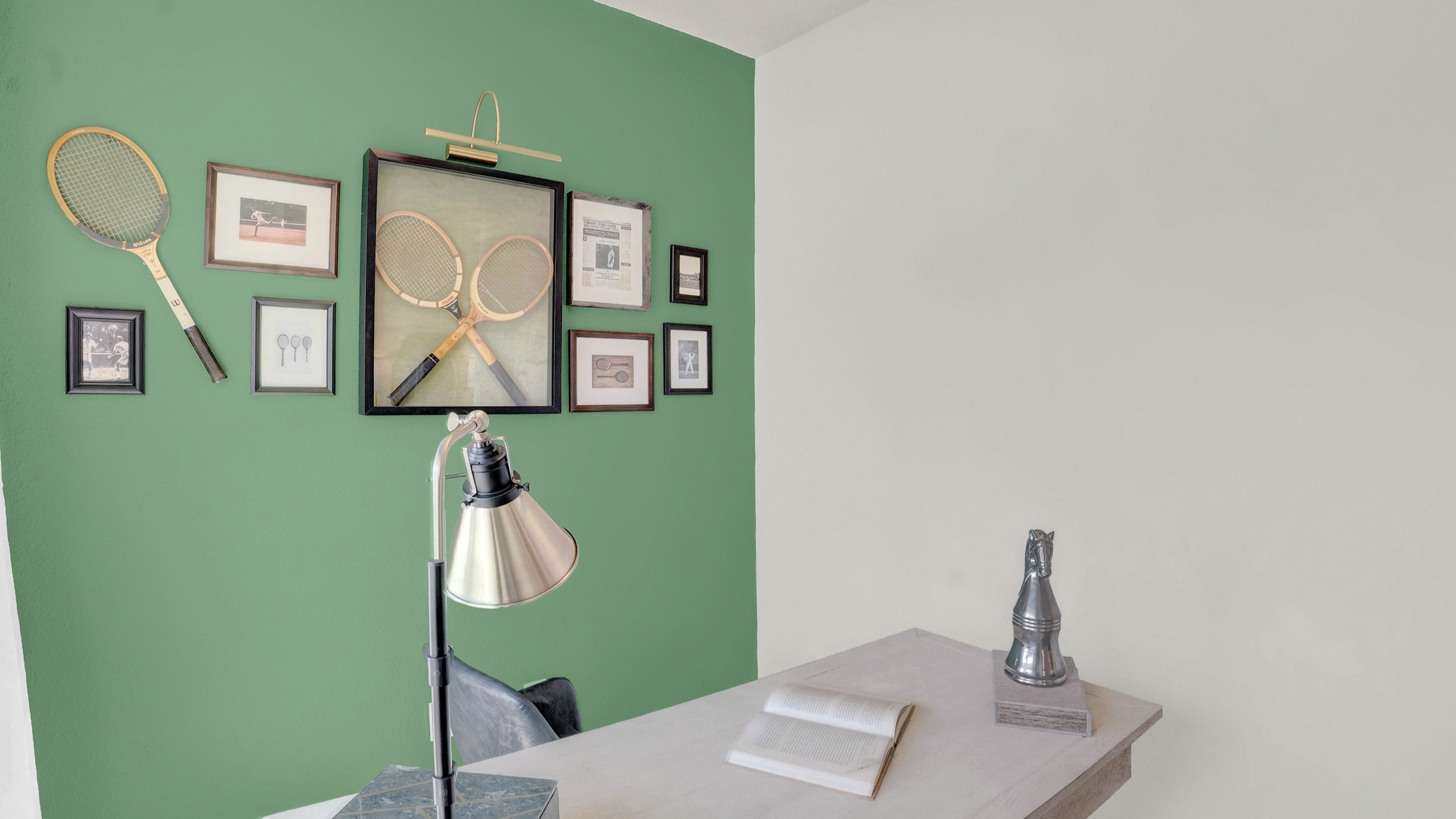 Study with desk and green walls.