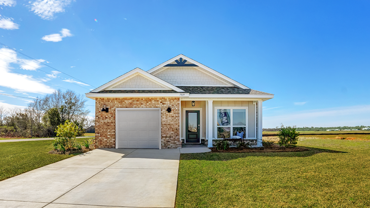 Single-story home with board and batten exterior, brick accents, a covered front porch, and one-car garage.