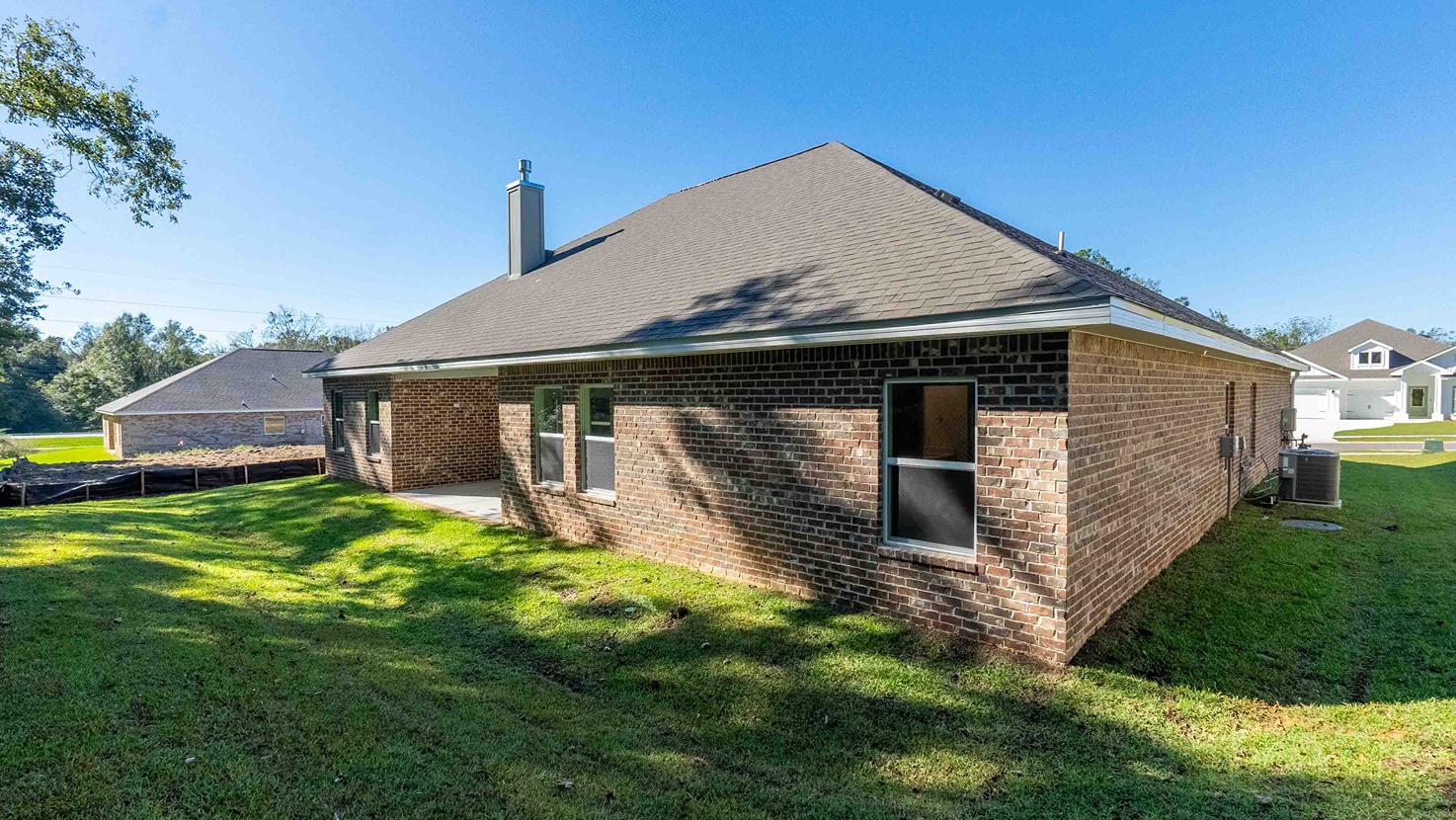 Avery covered back porch with brick exteriors