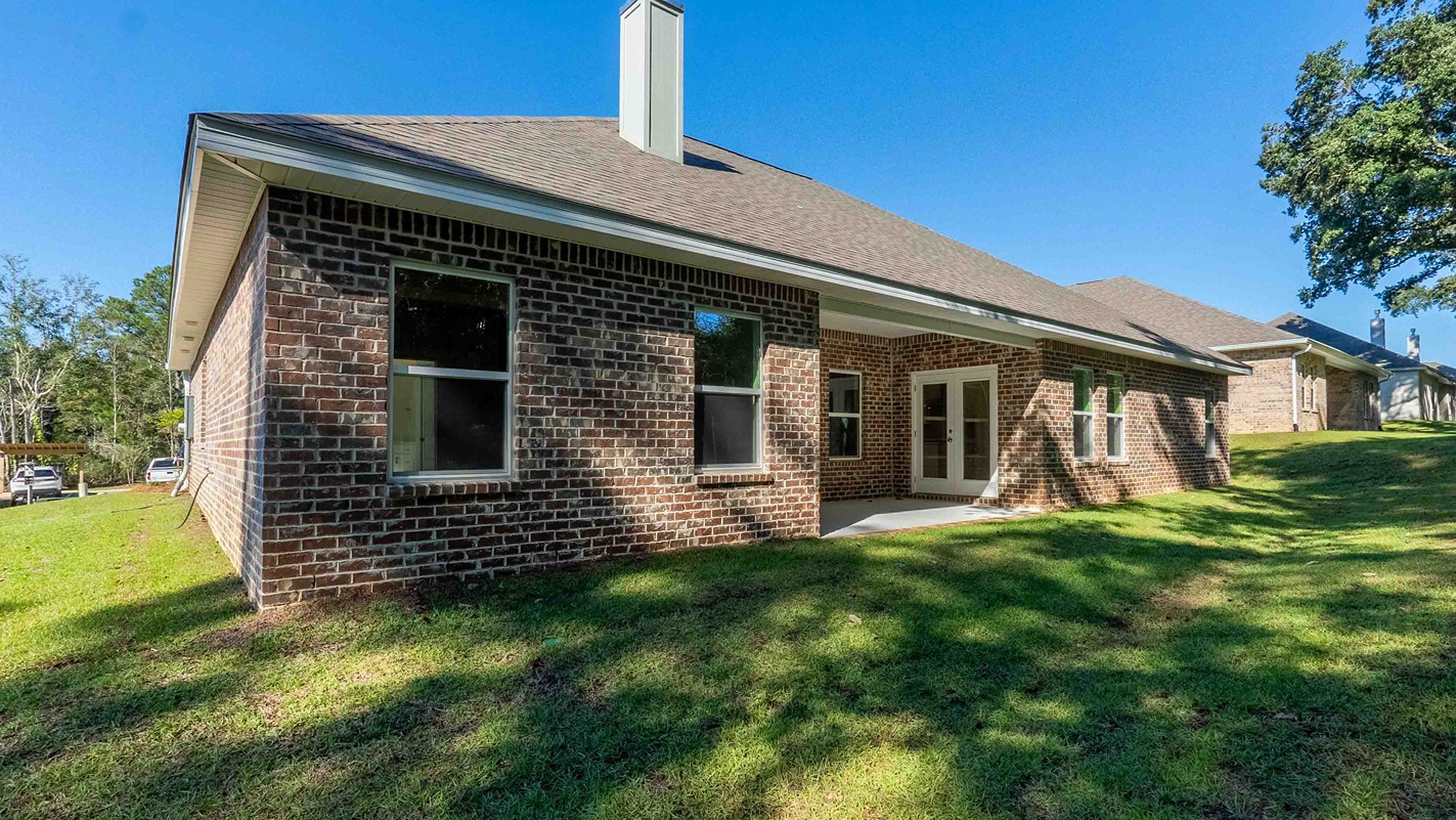 Avery covered back porch with brick exteriors