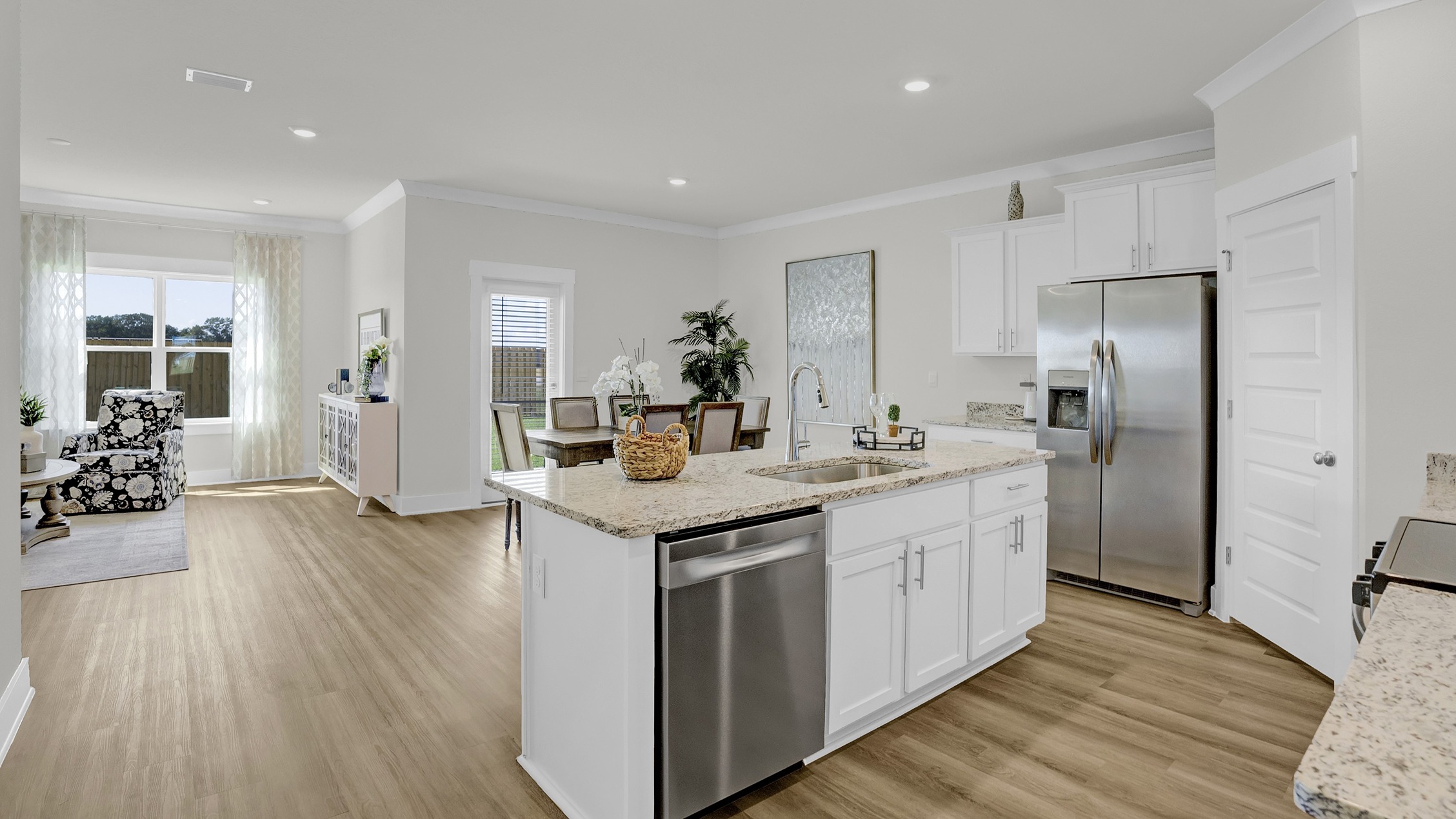 Entry to the open-concept great room connecting the kitchen, dining area, and living room.