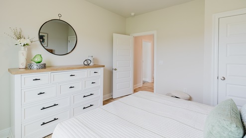 Open-concept interior of spare bedroom.