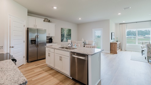 Open-concept interior of kitchen.