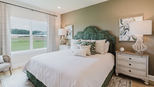 Open-concept interior of primary bedroom.