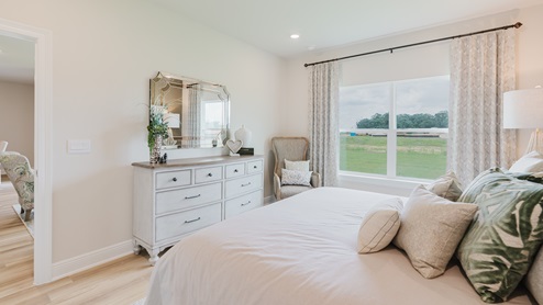 Open-concept interior of primary bedroom.