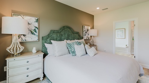 Open-concept interior of primary bedroom.