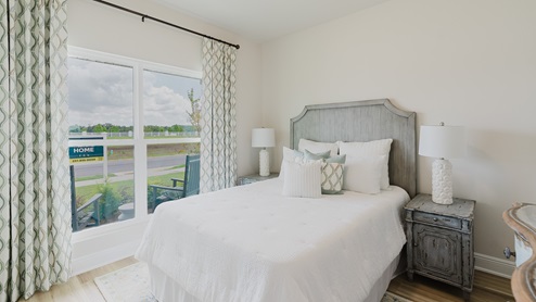 Open-concept interior of spare bedroom.