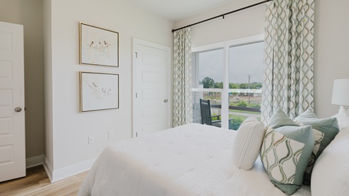 Open-concept interior of spare bedroom.