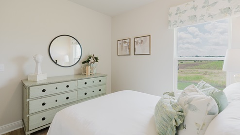 Open-concept interior of spare bedroom.
