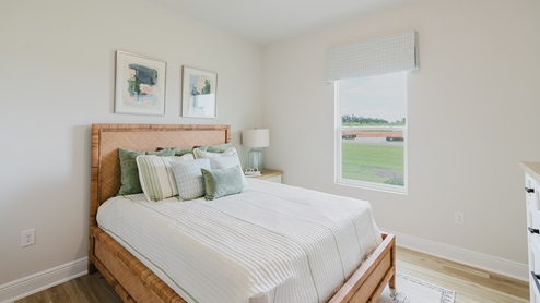 Open-concept interior of spare bedroom.