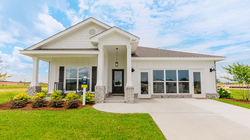 One-story home with a covered front porch and two-car garage.