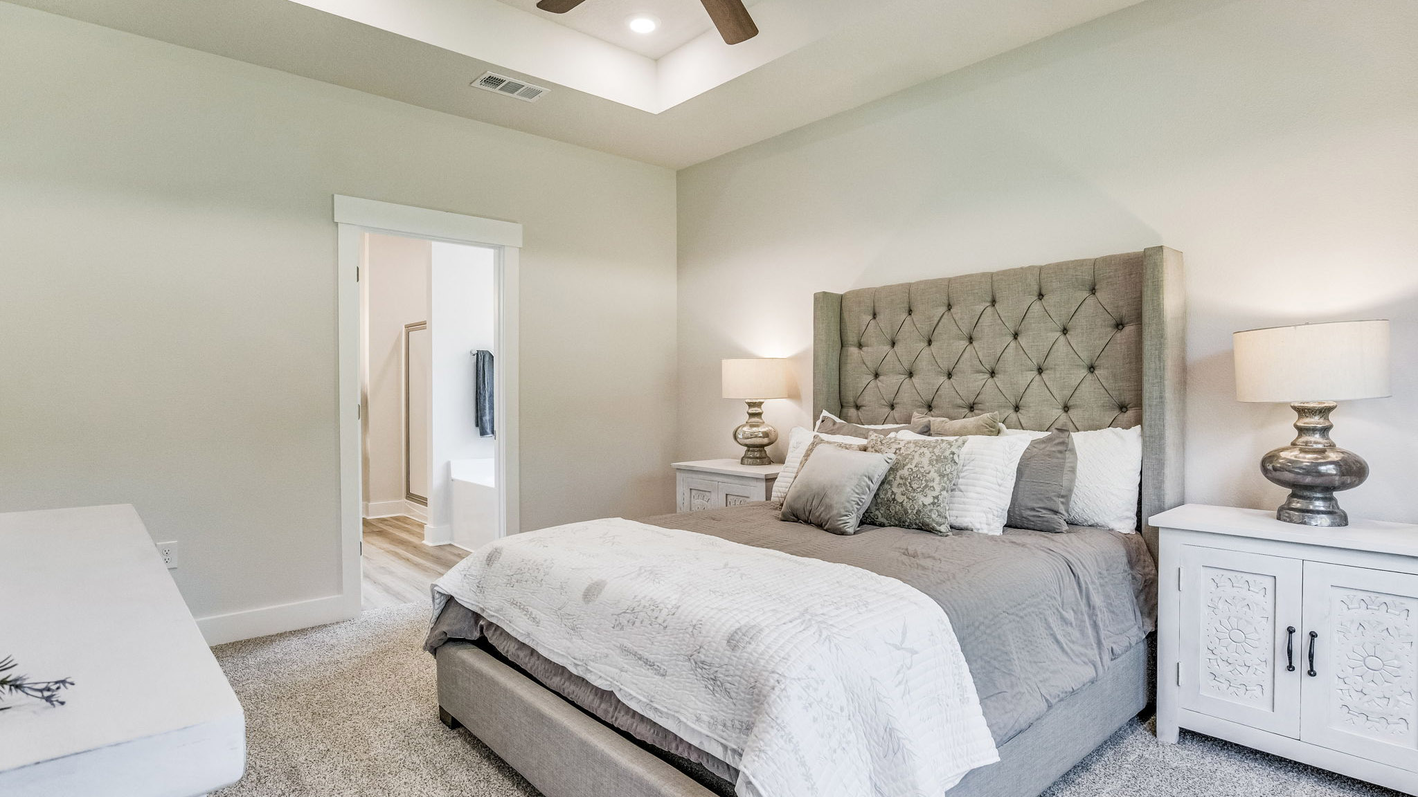 Spacious primary Rhett bedroom with trey ceilings connected off the living room.