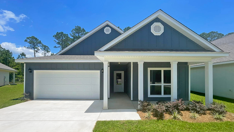 Single-story home with a covered front porch and two-car garage.