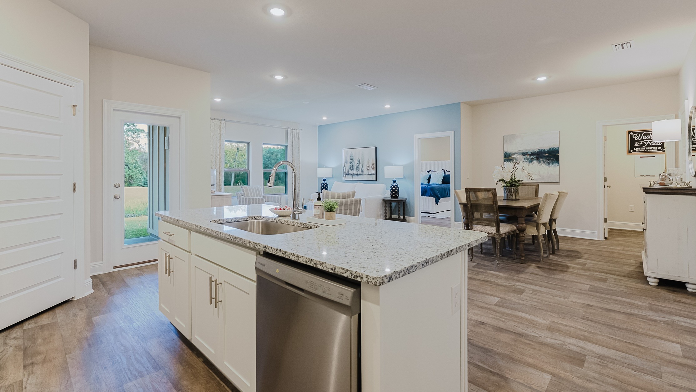 Open concept kitchen with 9-foot ceilings and granite countertops.