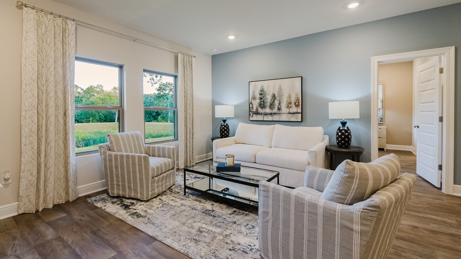 Open concept living room with 9-foot ceilings.