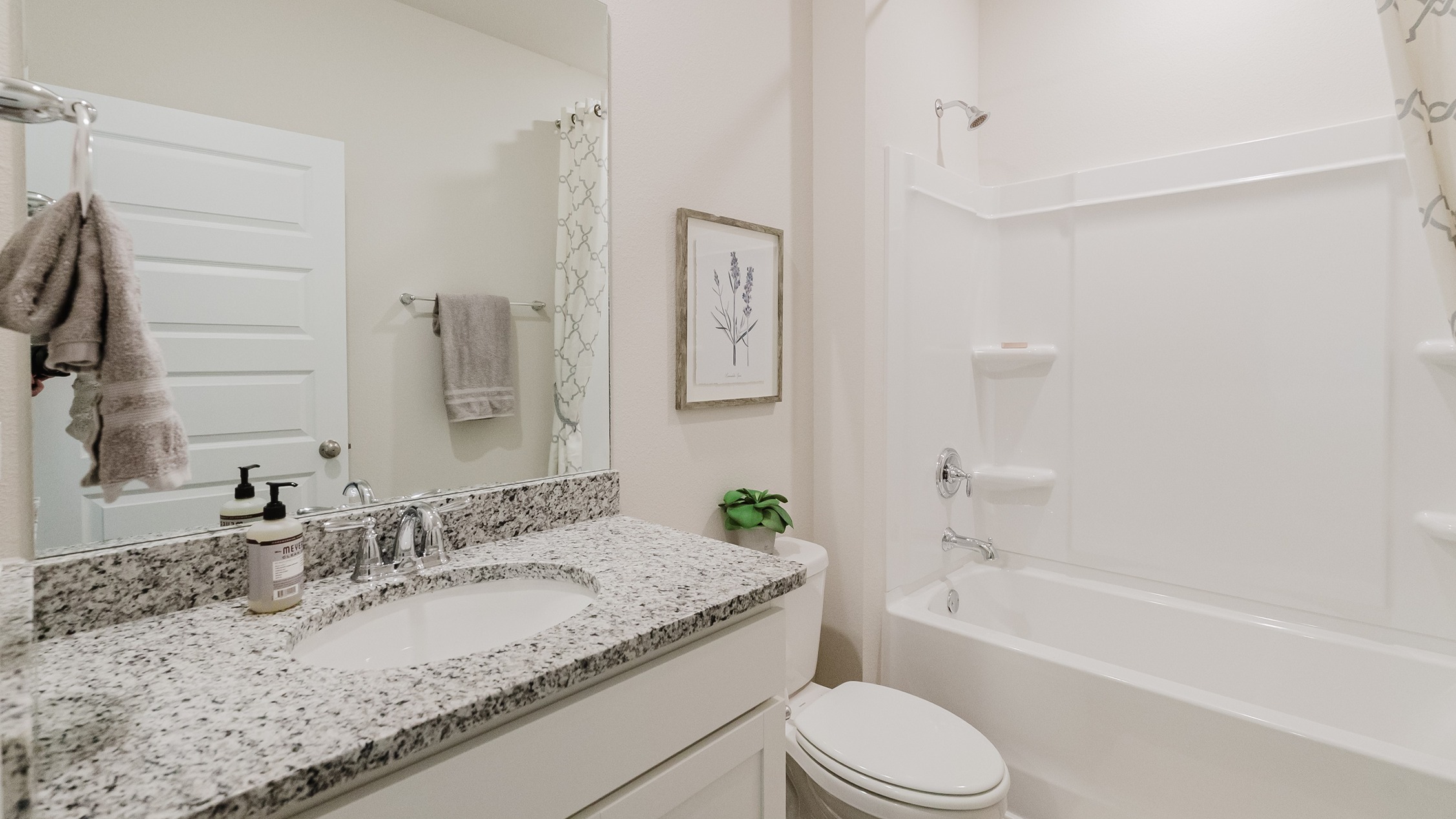 Second full bathroom with granite countertops.
