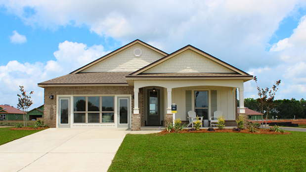 One-story home with a covered front porch and two-car garage.