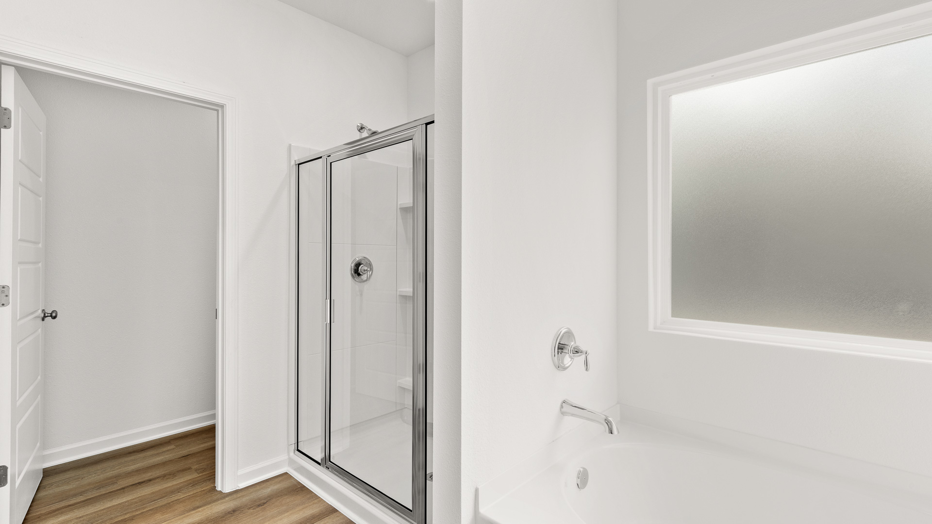 Primary bathroom with a 5-foot garden soaking tub and separate shower.