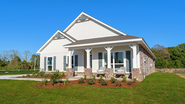Single-story home with a covered front porch and side-entry two-car garage.