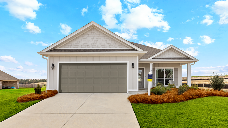 One-story home with a covered front porch and two-car garage.
