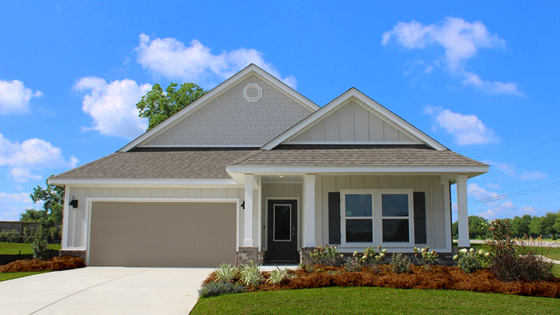 Single-story new home with a covered front porch and painted two-car garage.
