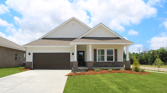 Single-story new home with a covered front porch and two-car garage on a corner lot.