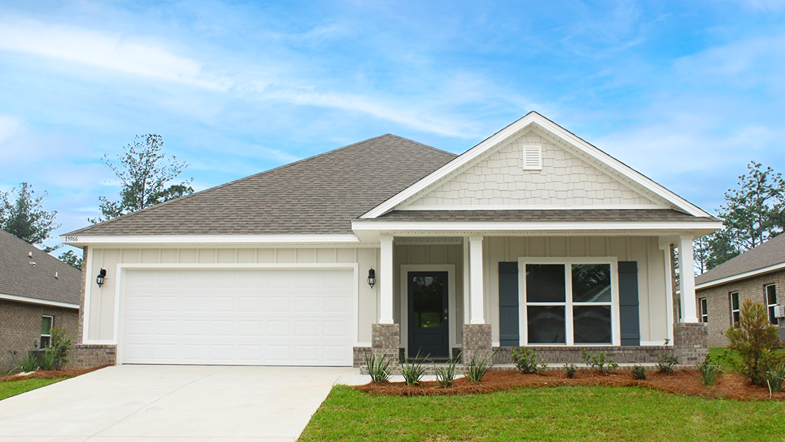 One-story home with a covered front porch and two-car garage.
