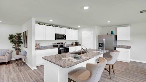 Gorgeous modern kitchen with white cabinets.