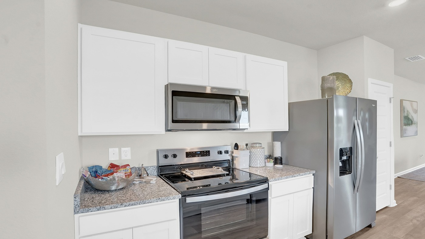 Kitchen area with stainless appliances.