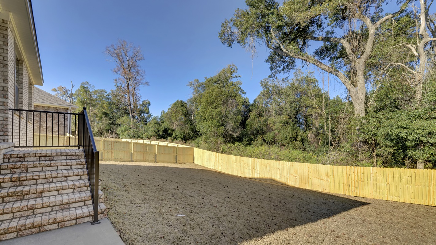 Denali covered back porch with black metal railing and brick steps