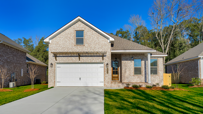 Two-story brick home with a covered front porch and two-car garage.