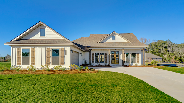 Single-story home with a covered front porch and courtyard-entry two-car garage.