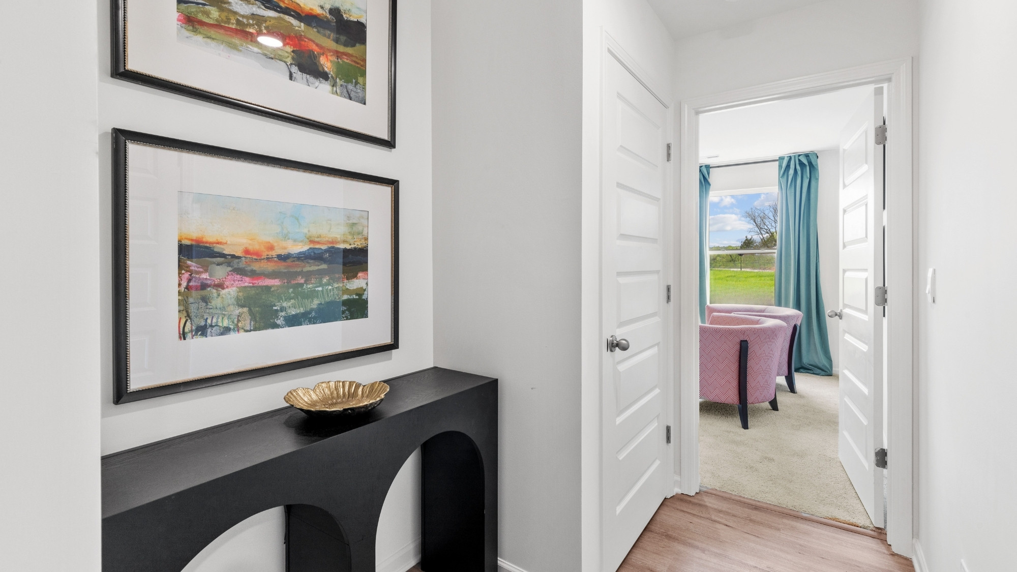 Open concept new home interior with 9-foot ceilings and vinyl flooring.