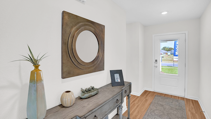 Open concept new home interior with 9-foot ceilings and vinyl flooring.
