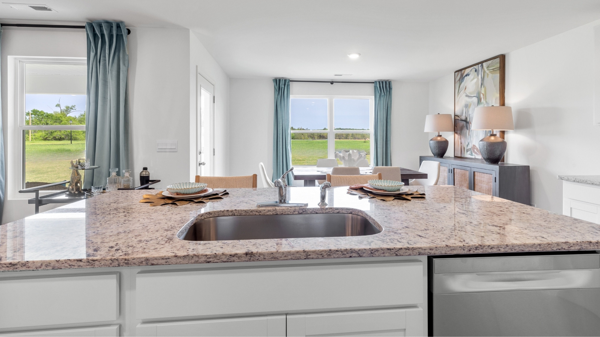 Open concept new home interior with 9-foot ceilings and vinyl flooring.