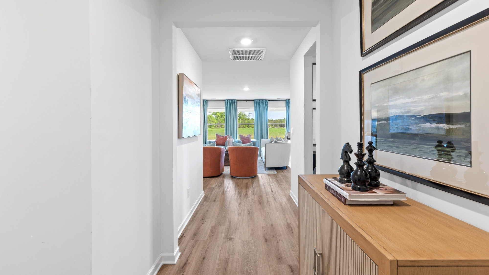 Open concept new home interior with 9-foot ceilings and vinyl flooring.