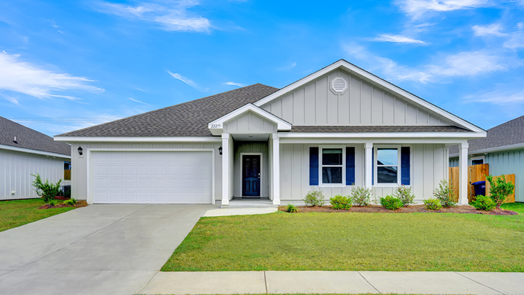 Single-story new home with a covered front porch and two-car garage.