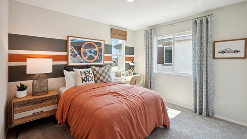 Fully furnished bedroom with full bed