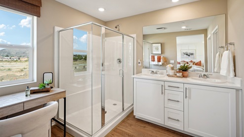 Primary bathroom with his and hers sinks and shower