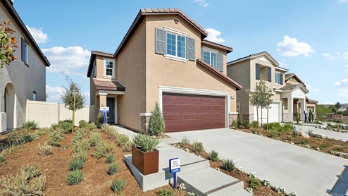 Two-story Tuscan home with stone veneer and two-car garage