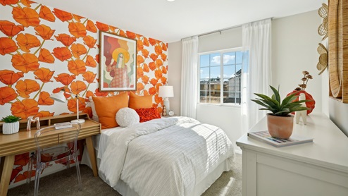 Fully furnished bedroom with full bed