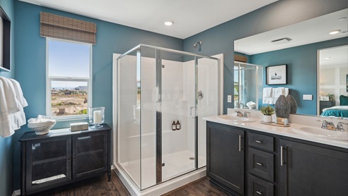 Primary bathroom with his and hers sinks and shower