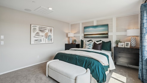 Spacious primary bedroom with king bed